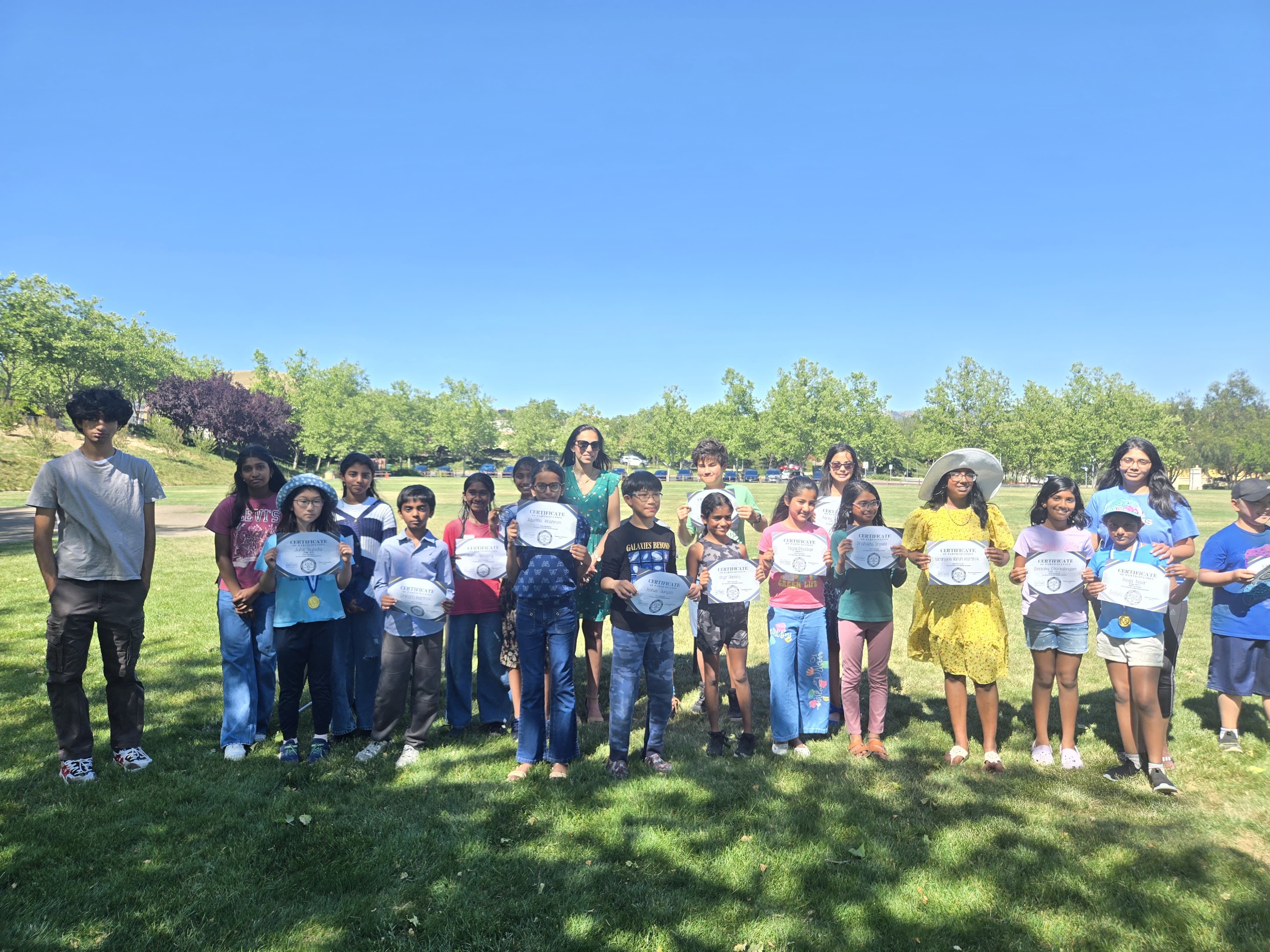 Students proudly displaying their certificates